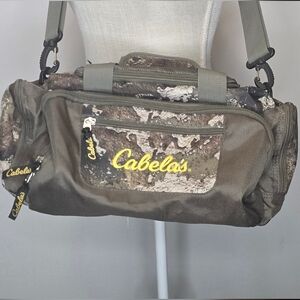Cabela's Camouflage Duffel Bag with Black and Brown Accents
